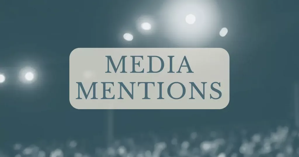 Leita The Seeker Media Mentions banner with blurred stage lights and an audience in the background